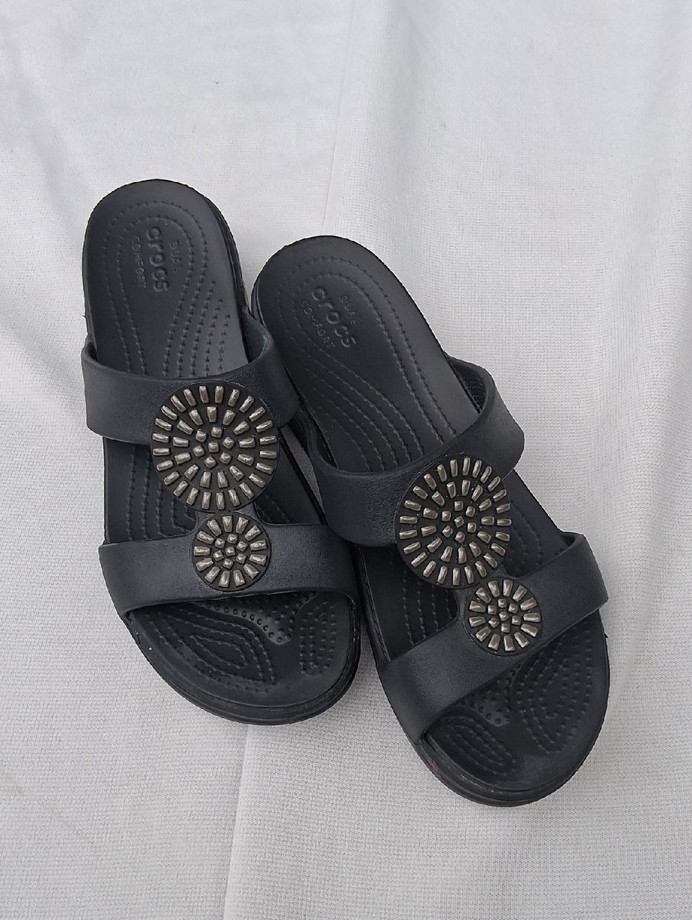CROCS Women’s Black Slide Sandals with Silver Medallions